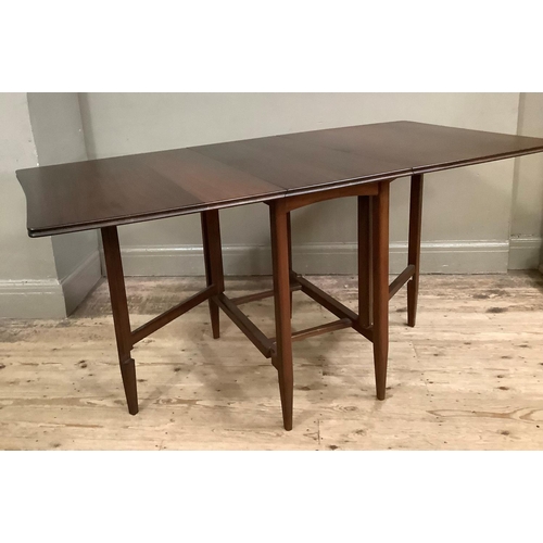 98 - A 1970's mahogany drop leaf dining table on rounded legs