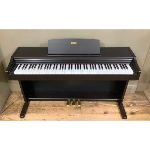 85 - A Celviano electric mini piano by Casio in ebonised case