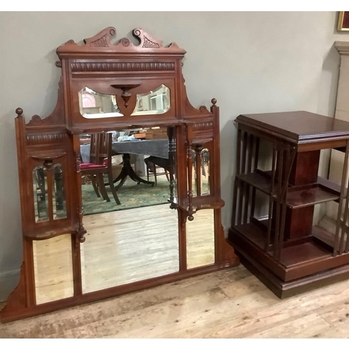 134 - An Edwardian mahogany revolving bookcase together with an over mantel mirror with shelves