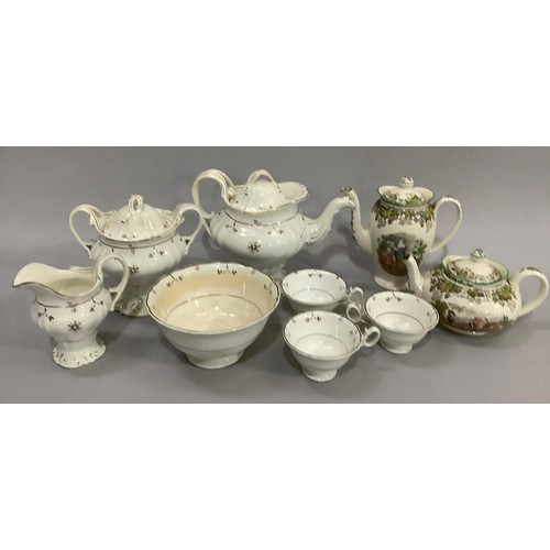 164 - An early Victorian tea service in white and gilt comprising a teapot with moulded spout, twin handle... 