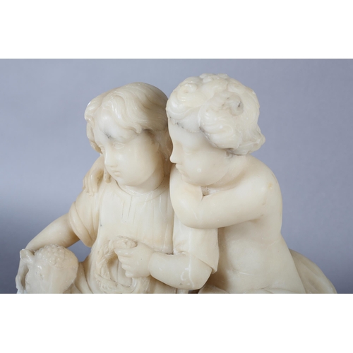 12 - A Victorian alabaster figure group of a young boy and girl the girl in a tunic holding a wreath with... 