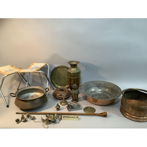 108 - A twin handled copper pan, a copper and brass coal scuttle, a wide rimmed copper bowl etched to the ... 