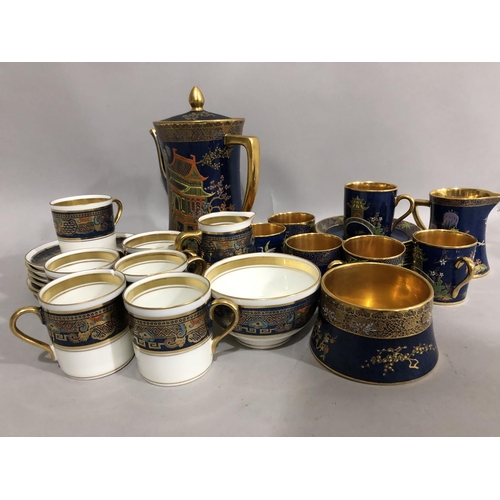 157 - A Carlton blue, and gilt coffee service comprising six coffee cans and saucers, milk jug, sugar bowl... 