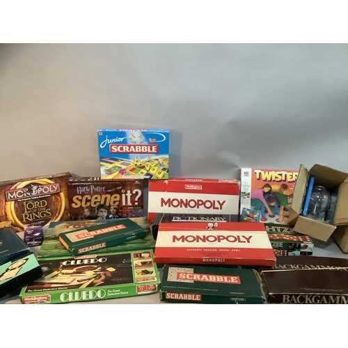 113 - A quantity of vintage and new board games including Totopoly, Monopoly, Trivial Pursuit, Lord of the... 