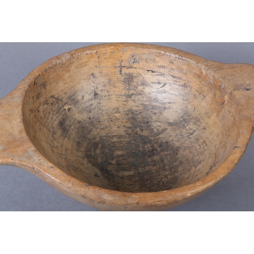 46 - A 19th century turned sycamore bowl with twin handles, 36cm over handles x 12cm high