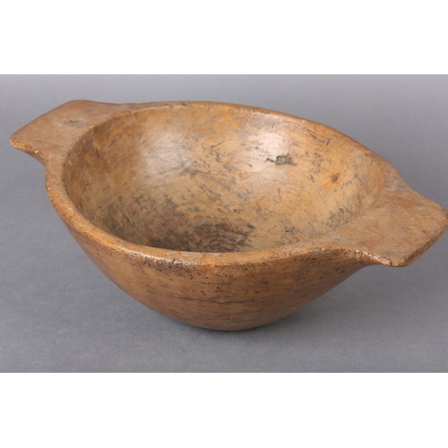 46 - A 19th century turned sycamore bowl with twin handles, 36cm over handles x 12cm high