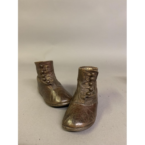 57B - Victorian boots for young children: a pair of brown leather ankle boots labelled Startrite, (company... 