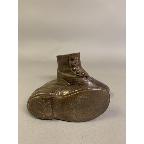 57B - Victorian boots for young children: a pair of brown leather ankle boots labelled Startrite, (company... 
