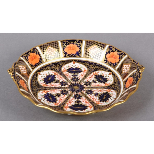 67 - A Royal Crown Derby Imari pattern twin handled bonbon dish date cypher for 1825, 25cm diameter