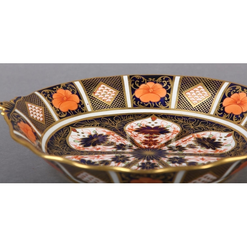 67 - A Royal Crown Derby Imari pattern twin handled bonbon dish date cypher for 1825, 25cm diameter