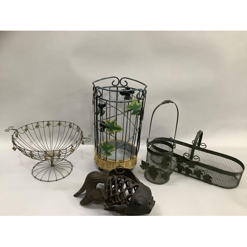 119 - A cast iron pierced fish shaped tea light holder, various wire baskets and plant holders