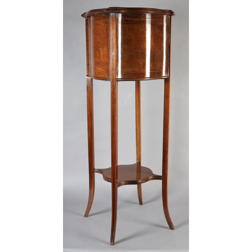 357 - AN EDWARD VII MAHOGANY AND SATINWOOD STRUNG JARDINIERE STAND of serpentine square form on tapering l... 