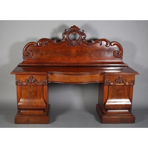 369 - A VICTORIAN FIGURED MAHOGANY PEDESTAL SIDEBOARD, the raised back with carved shell foliate and C-scr... 