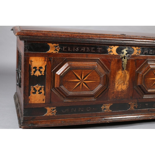 381 - AN 18TH CENTURY DUTCH COLONIAL TEAK AND EBONY TRUNK, having a low domed lid and twin panels to the f... 