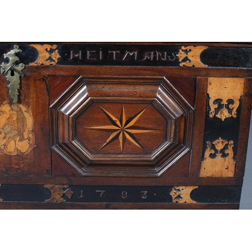 381 - AN 18TH CENTURY DUTCH COLONIAL TEAK AND EBONY TRUNK, having a low domed lid and twin panels to the f... 