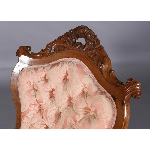 407 - A 19TH CENTURY WALNUT ARMCHAIR, having an encircling frame with pierced and carved foliate cresting ... 