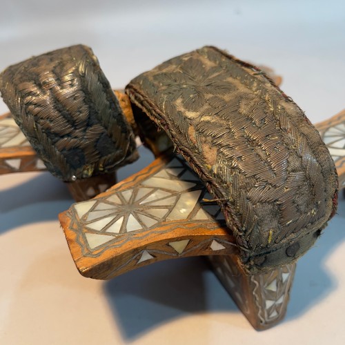 206 - A pair of Ottoman empire style wooden stilt shoes with mother-of-pearl inlay, the velvet and leather... 