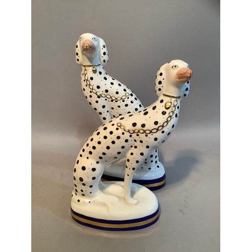 35 - A pair of Sutherland bone china dalmatians in the style of Staffordshire, 19.5 x 17cm