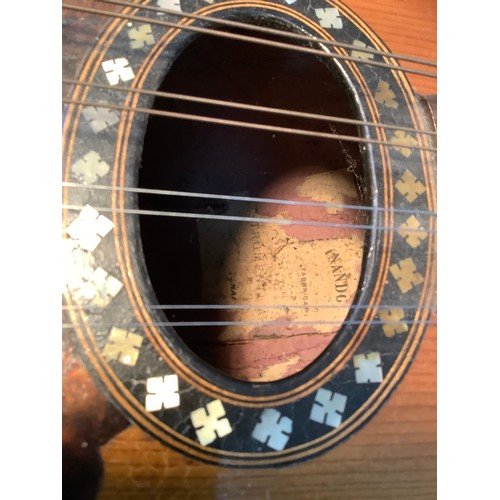 39 - An early 20th century Italian mandolin in rosewood and boxwood with mother of pearl and tortoise she... 