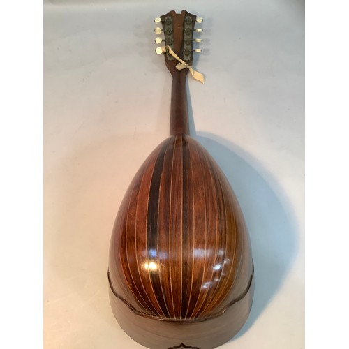 39 - An early 20th century Italian mandolin in rosewood and boxwood with mother of pearl and tortoise she... 