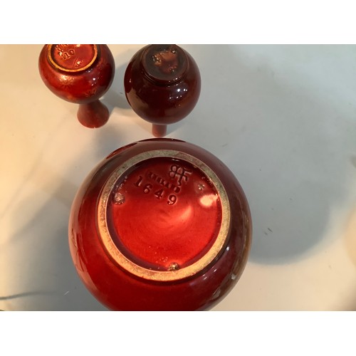 56 - A Burmantoft's faience vase with swollen rim in flambe red glaze impressed to base, BF 1649, 24cm hi... 