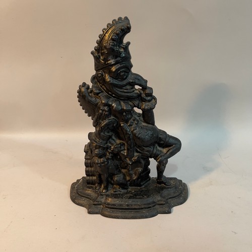 62 - A Victorian cast iron and black painted door stop in the form of punch, 32.5cm high