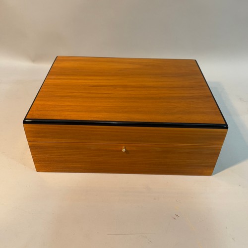 64 - A Hillwood walnut and ebonised laquered humidor, 30cm wide