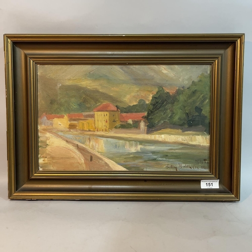 151 - An early 20th century river landscape with buildings, oil on canvas, indistinctly signed Lily Hul***... 