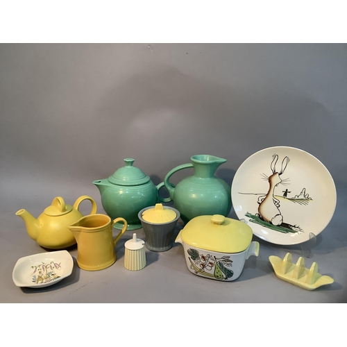 176 - A Fiesta USA teapot  and jug of mid green glaze, a New Zealand yellow glazed teapot, a Rostrand Gran... 