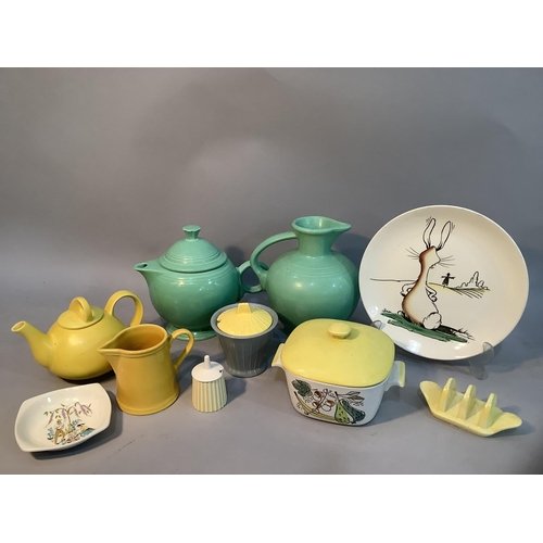 176 - A Fiesta USA teapot  and jug of mid green glaze, a New Zealand yellow glazed teapot, a Rostrand Gran... 