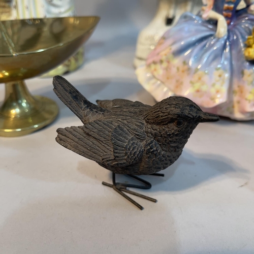 191 - A brass boat shaped pedestal covered dish with hinged lid together with an African hardwood carving ... 