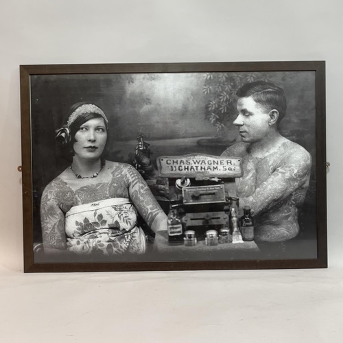 197 - Three black and white framed photographic prints showing people being tattooed, 60cm x 90cm