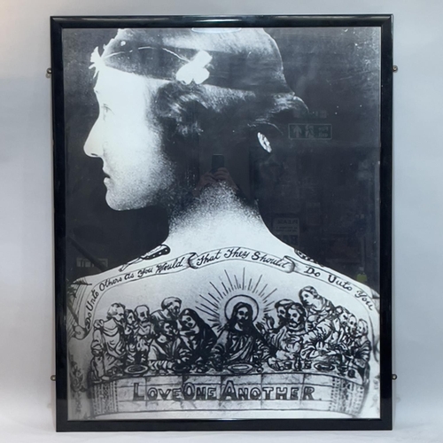 199 - Four black and white photographic prints of historic people with tattoos, largest example