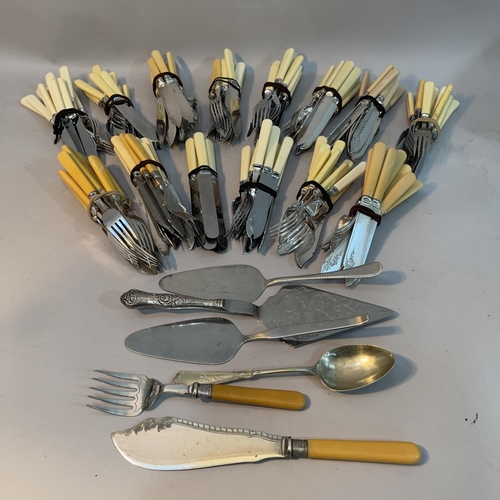 256 - A large quantity of fish knives and forks in sets, servers, cake slices etc