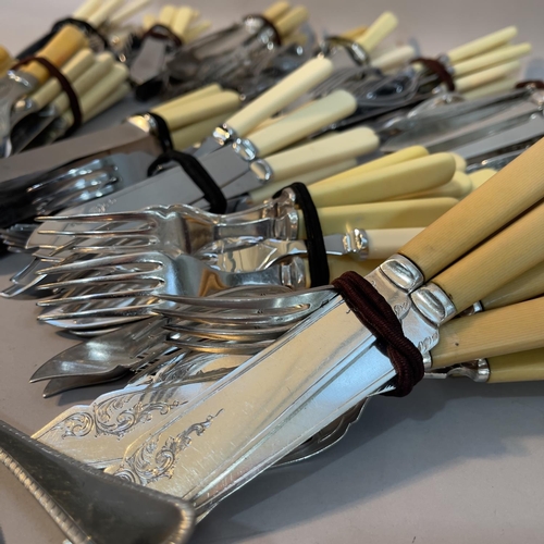 256 - A large quantity of fish knives and forks in sets, servers, cake slices etc