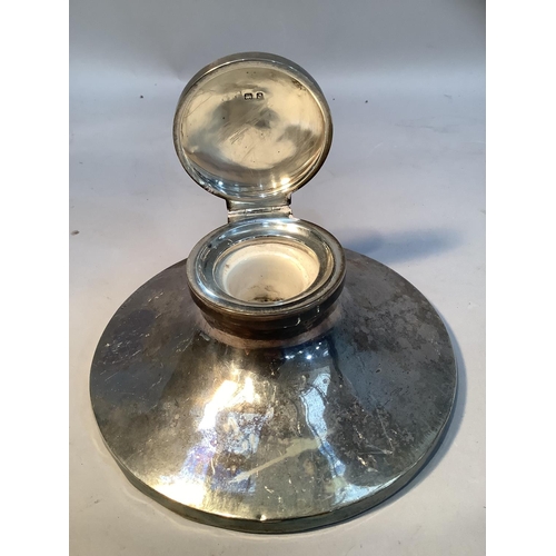 291 - A silver inkwell on circular spreading base, 14cm diameter, Birmingham 1933