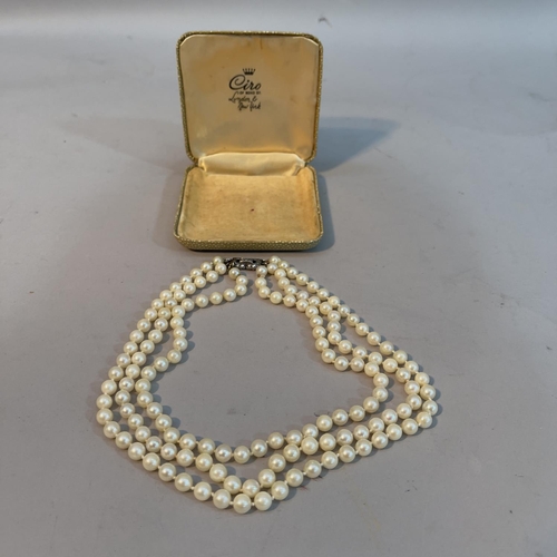 348 - A cultured pearl choker necklace, the 6-6.5mm pearls in three rows (at fault) fastened with a marcas... 