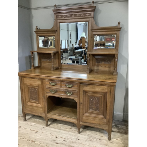 362 - A late 19th century mid oak mirror back sideboard having a moulded cornice and carved with a frieze ... 