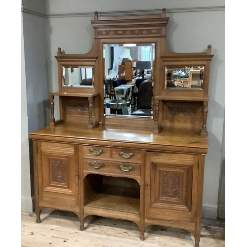 362 - A late 19th century mid oak mirror back sideboard having a moulded cornice and carved with a frieze ... 