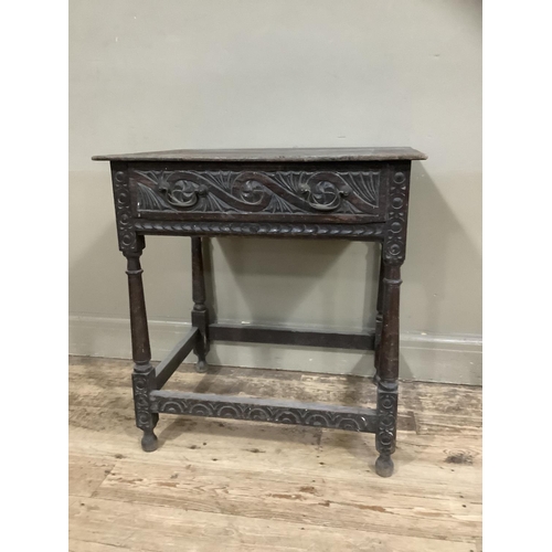 363 - A 19th century oak side table carved border to the surface and frieze drawer, on turned and square f... 