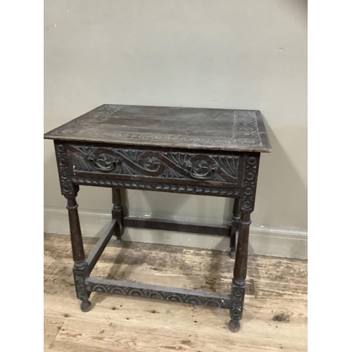 363 - A 19th century oak side table carved border to the surface and frieze drawer, on turned and square f... 