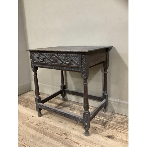 363 - A 19th century oak side table carved border to the surface and frieze drawer, on turned and square f... 