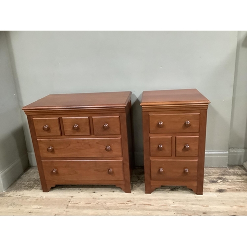 388 - Two cherry wood bedside chests, one having three small drawers across and two further drawers, the o... 