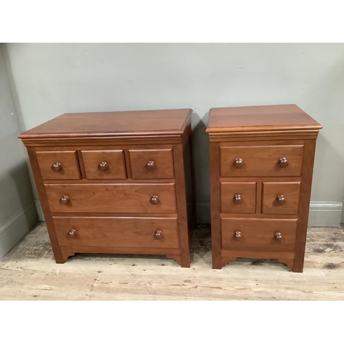 388 - Two cherry wood bedside chests, one having three small drawers across and two further drawers, the o... 