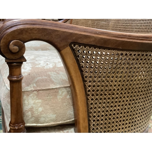 393 - A 1920s/30s walnut and begere tub backed chair on cabriole legs with upholstered cushion