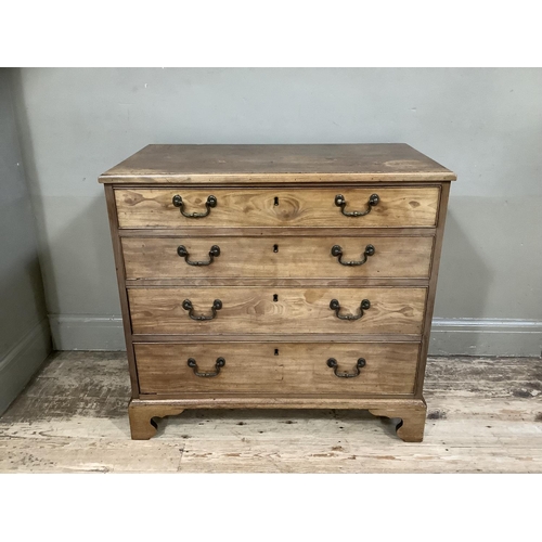 397 - A mahogany chest of four long graduated drawers with cast swing handles and on shaped bracket feet, ... 