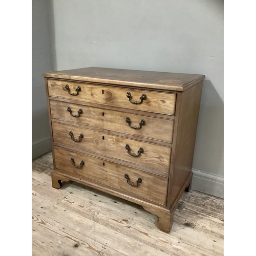 397 - A mahogany chest of four long graduated drawers with cast swing handles and on shaped bracket feet, ... 