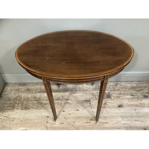 400 - An Edwardian and mahogany and rosewood cross banded occasional table of oval outline, ebony and boxw... 