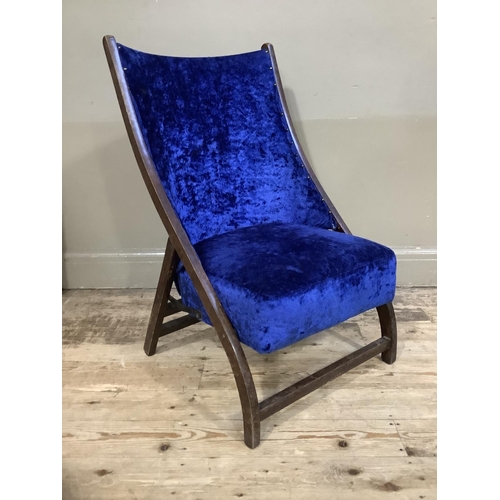 408 - An early 20th century folding chair upholstered in blue crushed velvet to the seat and back