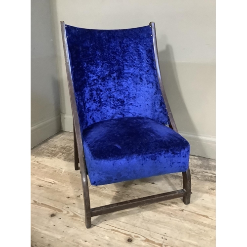 408 - An early 20th century folding chair upholstered in blue crushed velvet to the seat and back